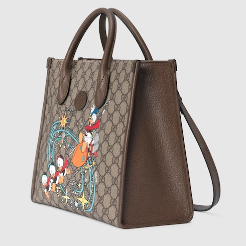 Disney X Gucci唐老鸭印花托特包in米色和乌木色gg Supreme帆布 Gucci Ae Disney X Gucci唐老鸭印花托特包in米色和乌木色gg Supreme帆布 Gucci Ae
