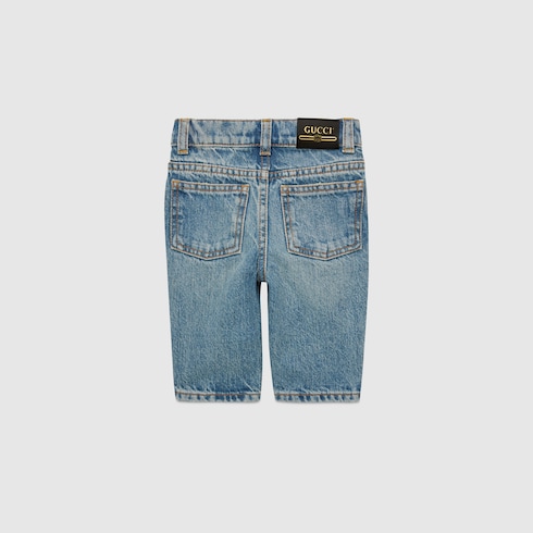 Gucci Tiger jeans con ricamo in celeste | GUCCI® Italia