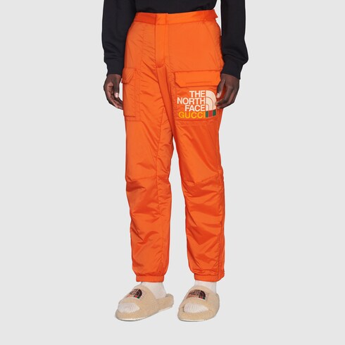 Pantalone The North Face x Gucci in arancione | GUCCI® Italia
