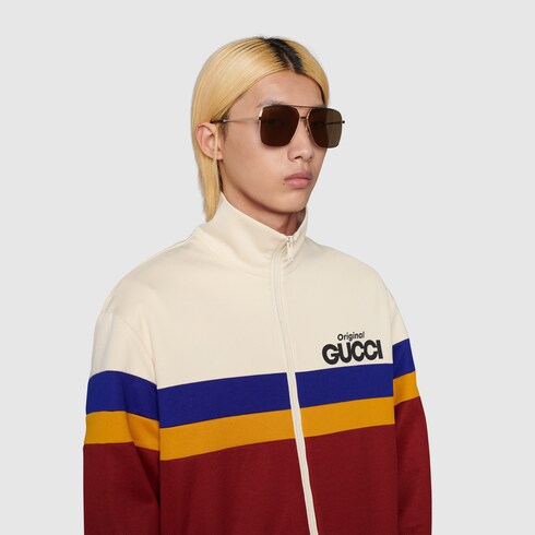 Occhiali da sole con ponte basso in metallo color oro | GUCCI® Italia