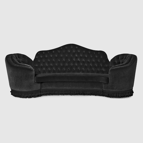 Capitonné camelback sofa