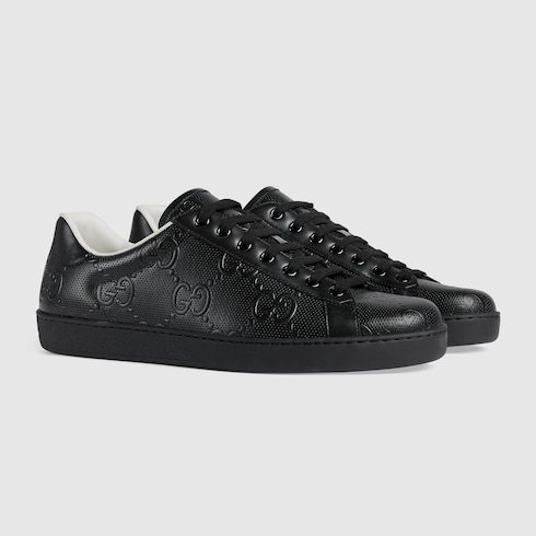 Men's Ace GG embossed sneaker in black leather | GUCCI® US