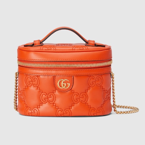 GG Matelassé top handle mini bag in Orange Leather | GUCCI® SI