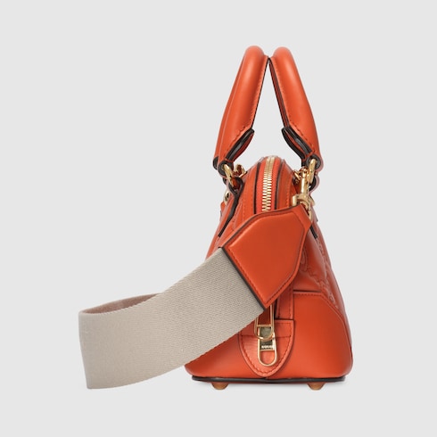 GG Matelassé mini top handle bag in orange leather | GUCCI® SG