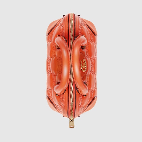 GG Matelassé mini top handle bag in orange leather | GUCCI® SG