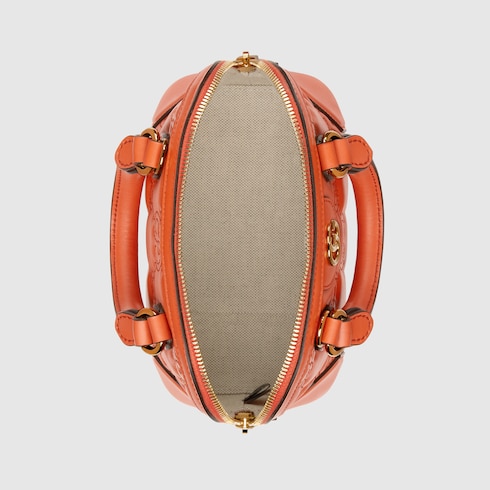 GG Matelassé mini top handle bag in orange leather | GUCCI® SG