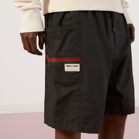 Coated cotton shorts with Gucci label