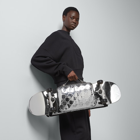 Skateboard mit Gucci Logo