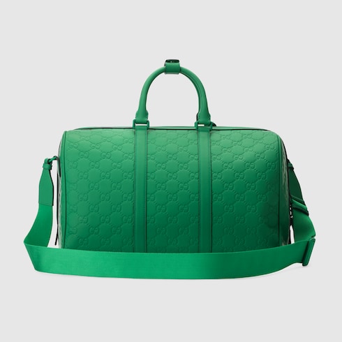 Mittelgroße GG Reisetasche mit Gummieffekt in grünes Leder | GUCCI® DE