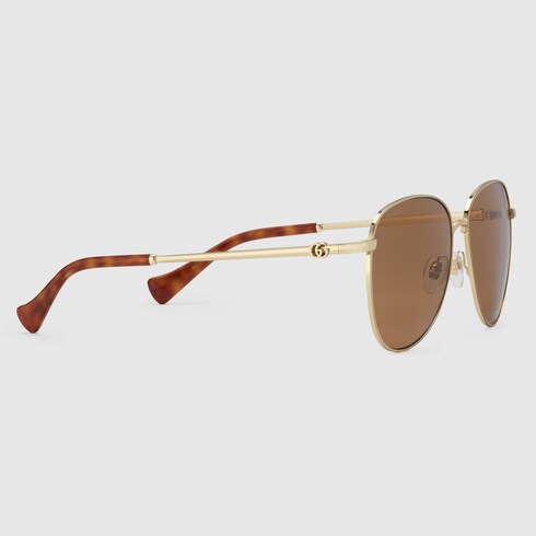Navigator frame sunglasses in gold toned metal GUCCI Canada