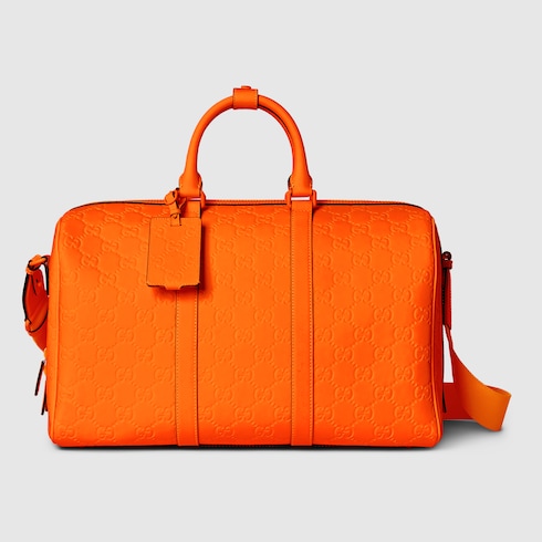 GG rubber effect medium duffle bag in bright orange leather GUCCI UK