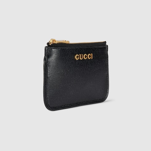 Étui à clés zippé avec inscription Gucci