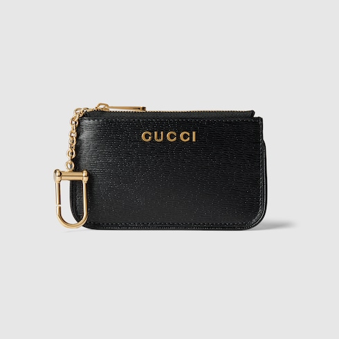 Étui à clés zippé avec inscription Gucci