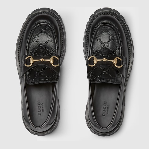 Women s Horsebit loafer with lug sole in black leather GUCCI AE