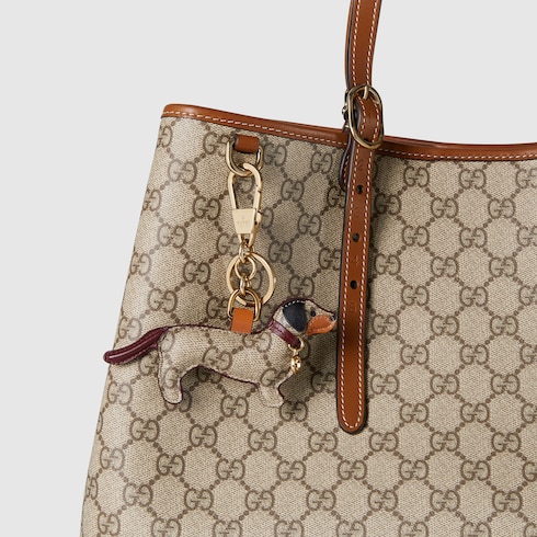 KW Dog shaped bag charm in beige and dark brown canvas