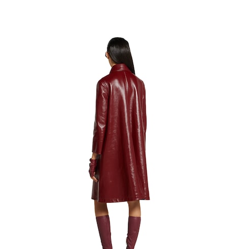 Manteau à double boutonnage en cuir brillant