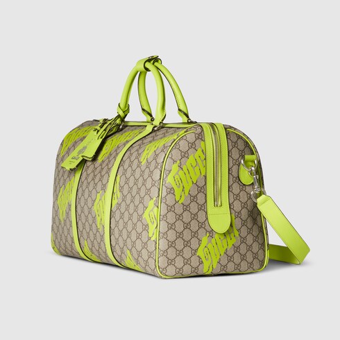 Medium duffle bag with print in beige and dark brown GG