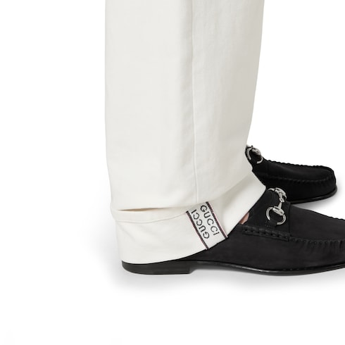 Pantalon en denim à lisière en coton