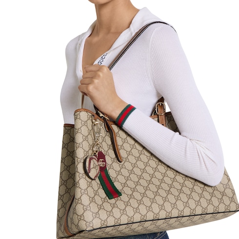Llavero Gucci Tennis con tribanda Web en tejido con GG beige y