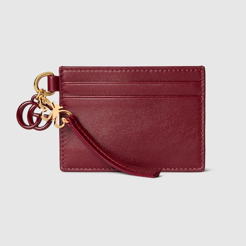 Tarjetero con Doble G y dije de mariposa