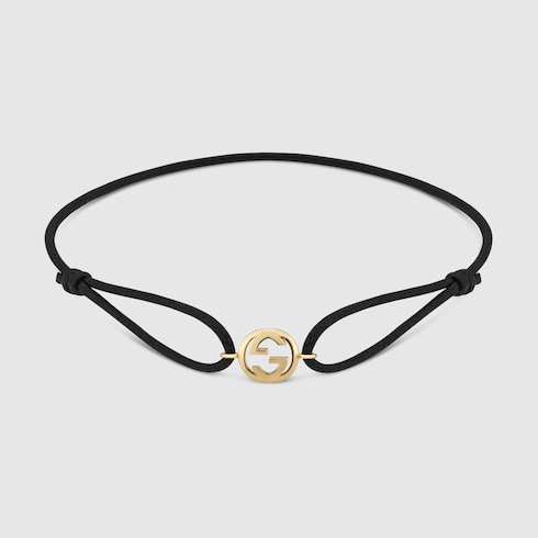 Bracelet avec charm 18 carats Gucci Interlocking