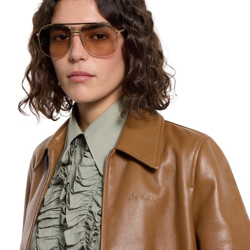 Veste en cuir avec logo Gucci