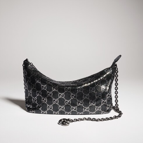 Bolsa de noche metálica con dije