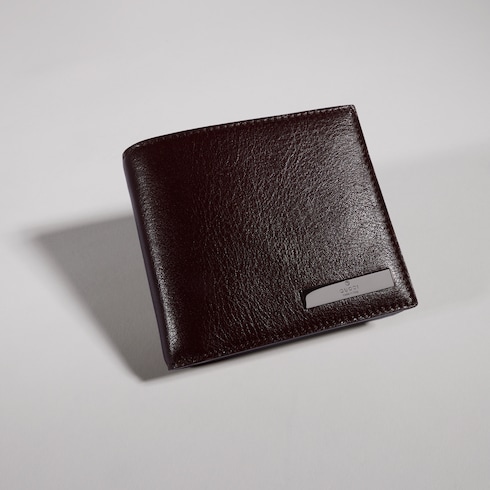 Coin wallet with metal tag