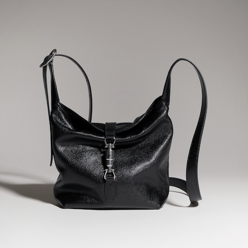 Minibolso con cierre de pistón