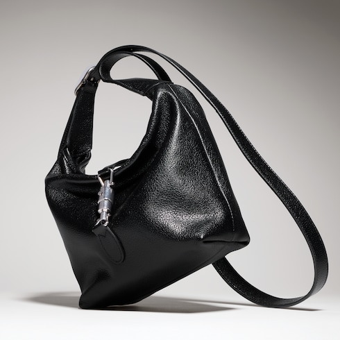 Mini bag with piston closure