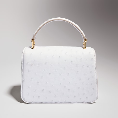 Gucci Siena ostrich small top handle bag in white | GUCCI® US