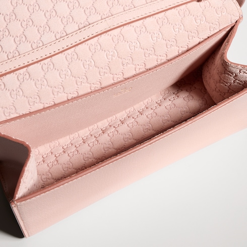 Mini pouch with Gucci lettering
