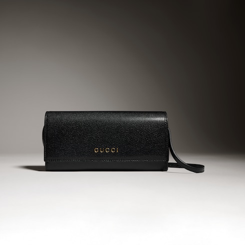 Portefeuille avec sangle et inscription Gucci
