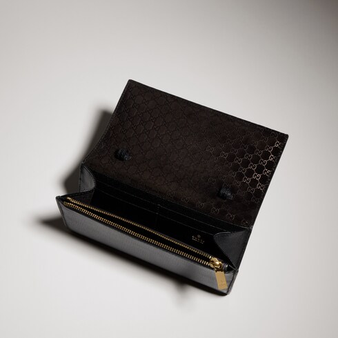 Portefeuille avec sangle et inscription Gucci