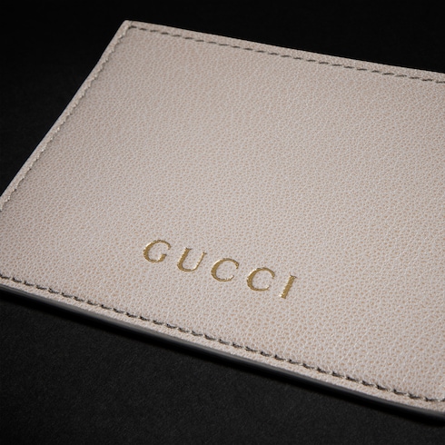 Tarjetero con letras Gucci