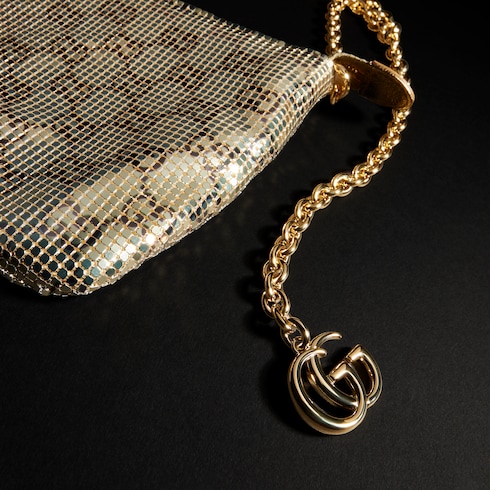 Bolsa de noche metálica con dije