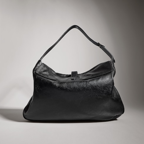 Large crossbody bag with piston closure