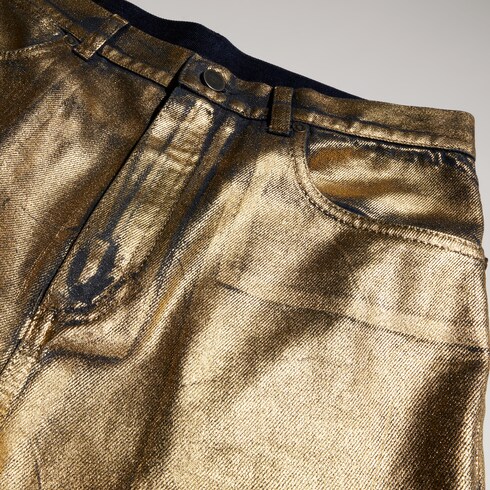 Pantalone slim in denim di cotone spalmato