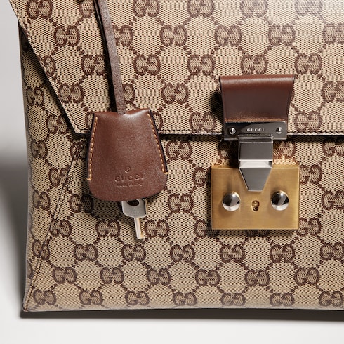 Medium top handle bag with lock