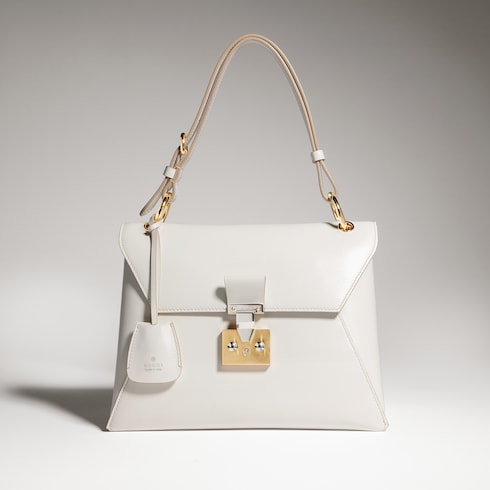 Small top handle bag with lock