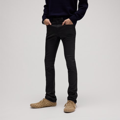 Pantaloni in denim di cotone stretch spalmato