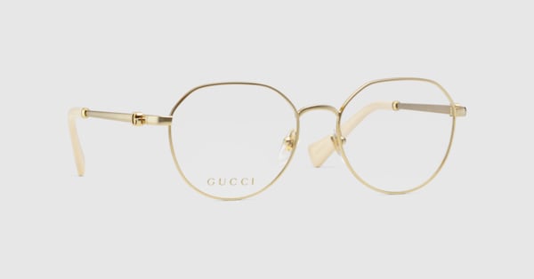 Round optical frame in gold toned metal GUCCI US