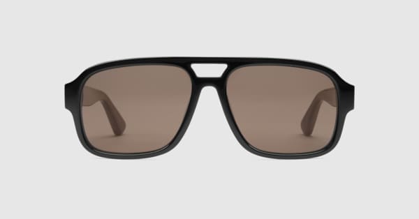 Navigator frame sunglasses in black injection | GUCCI® RO