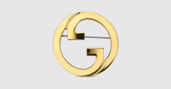Broche Gucci Blondie en metal de color oro amarillo | GUCCI® ES