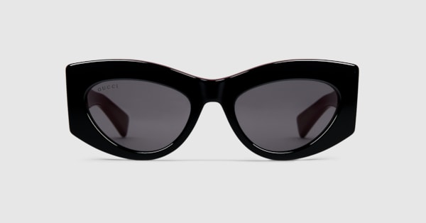 Cat-eye frame sunglasses in black and Gucci Rosso Ancora red