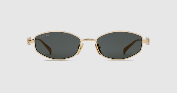 Oval frame sunglasses in yellow gold-toned | GUCCI® UK
