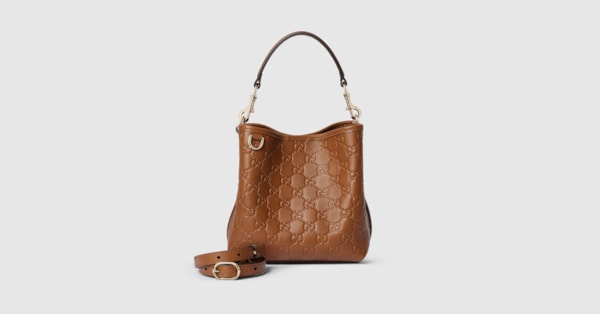 GG Emblem small bucket bag in brown GG leather | GUCCI® US