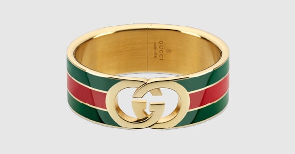 Gucci Interlocking bangle bracelet in gold-toned brass | GUCCI® US