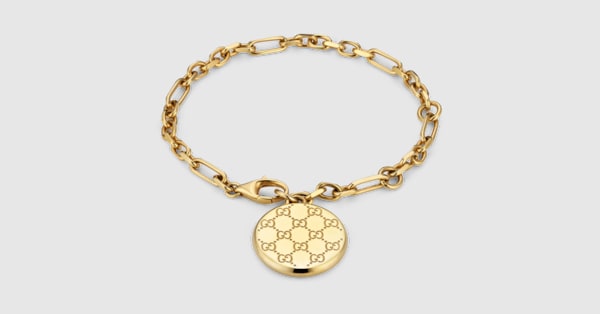 GG motif charm chain bracelet in gold-toned brass | GUCCI® US