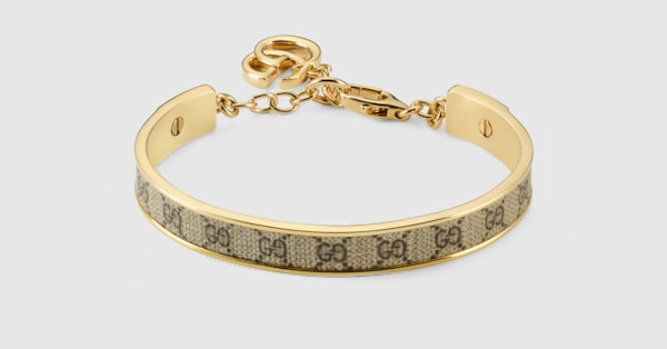 GUCCI ブレスレット バングル ダブルG Bangle bracelet with Double G charm in gold-toned brass | GUCCI® US